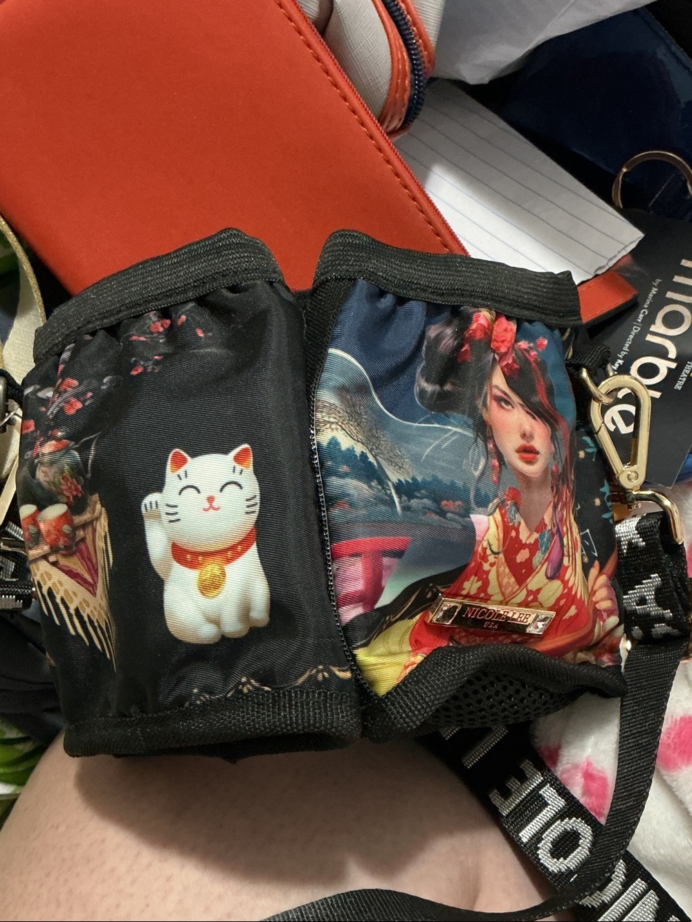 Nicole Lee Black Floral Lucky Cat Crossbody Bag and luggage cupholder